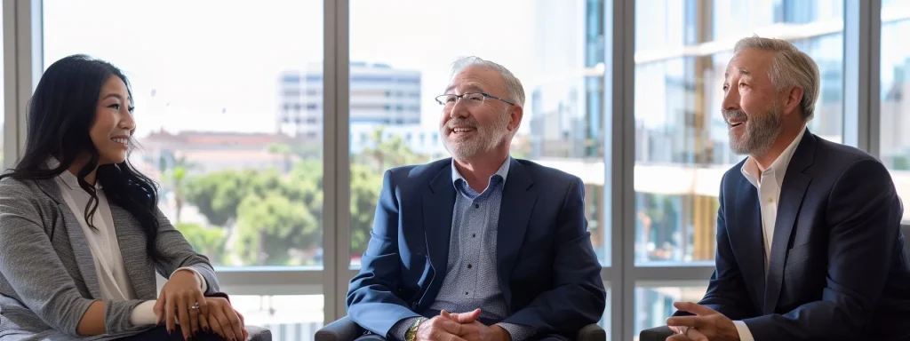 a professional and dynamic portrait showcasing three distinguished worker compensation attorneys in a modern long beach office, exuding confidence and expertise as they engage in a collaborative discussion illuminated by soft, natural light streaming through large windows.