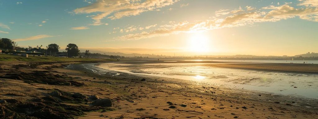 a serene long beach landscape featuring a diverse group of determined individuals engaging in support and collaboration, symbolizing the strong community resources available for injured workers navigating the workers' compensation process.