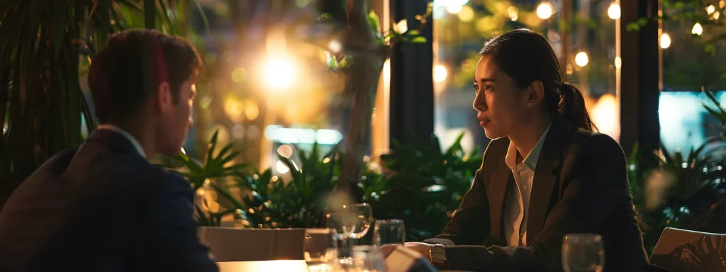 a professional negotiation setting features a poised individual engaging in a focused discussion with an insurance adjuster, lit by soft, warm lighting that enhances the atmosphere of trust and collaboration.